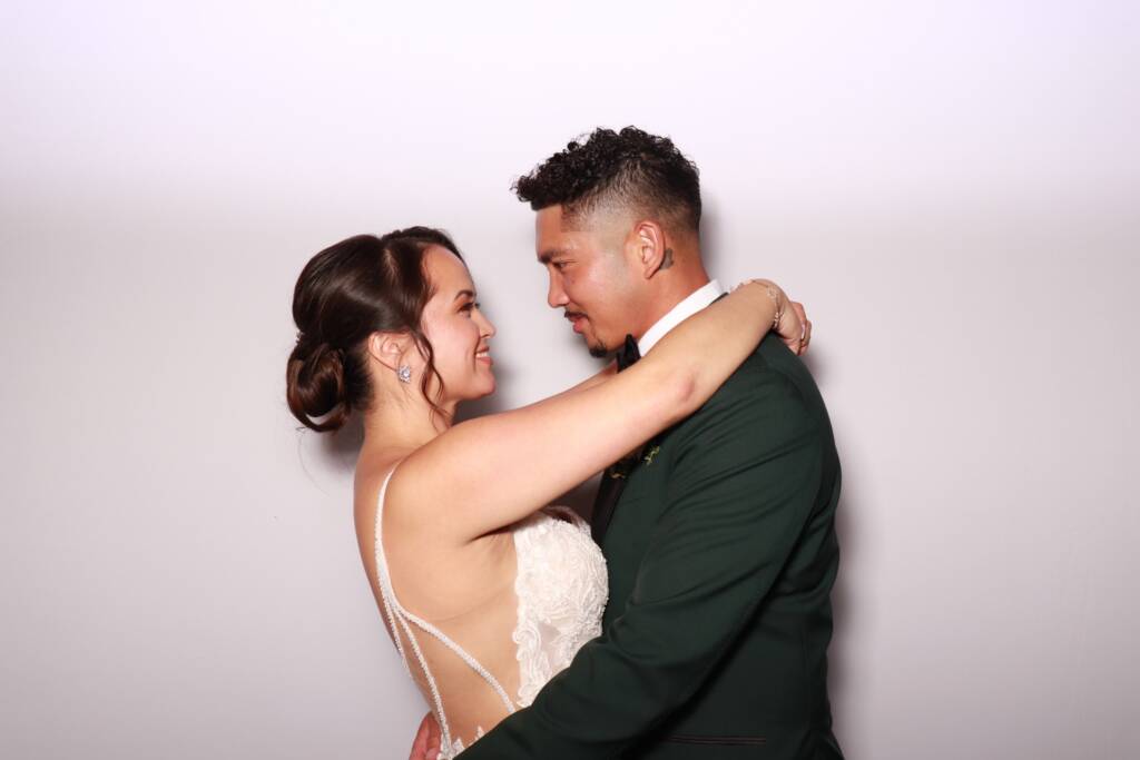 Bride and groom at a wedding photo booth